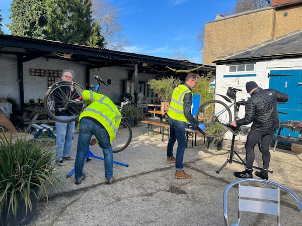 Team working on two bikes